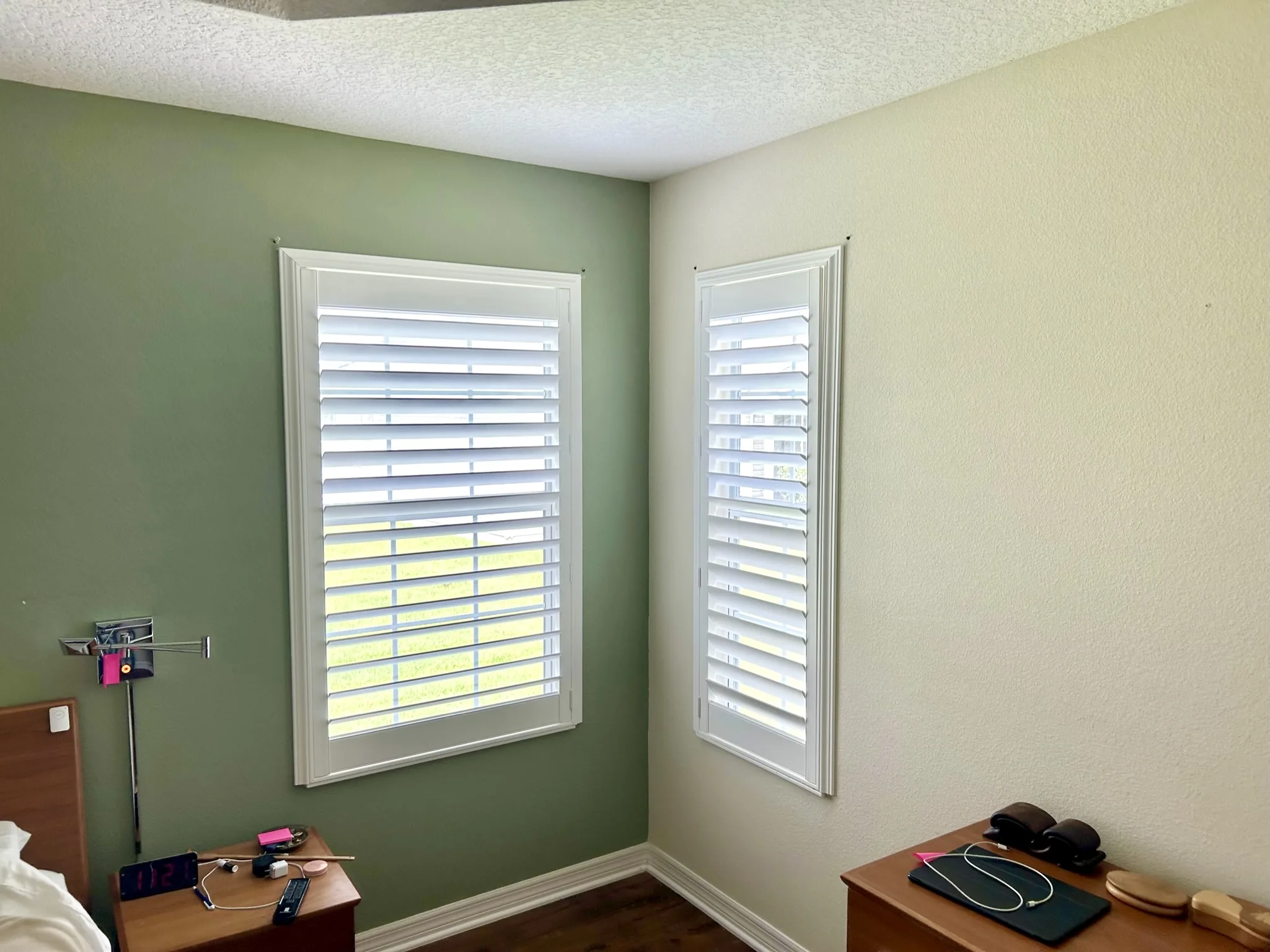 Open plantation shutters in a bedroom